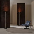 Modern interior with floor lamps and a blue chair