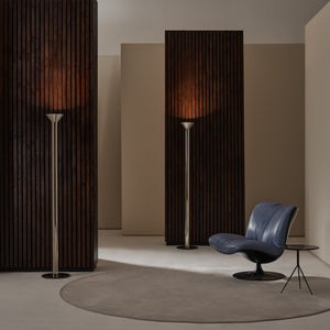 Modern interior with floor lamps and a blue chair